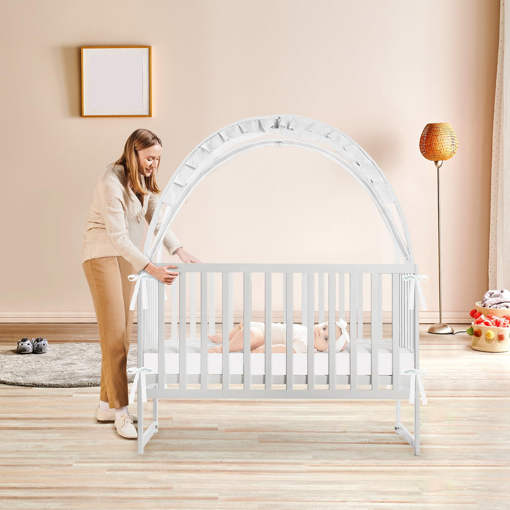 Generic crib tent in crib with baby showing safe sleep space