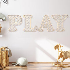 Generic Play Sign wooden letters on wall with warm rustic finish for a cozy playroom.