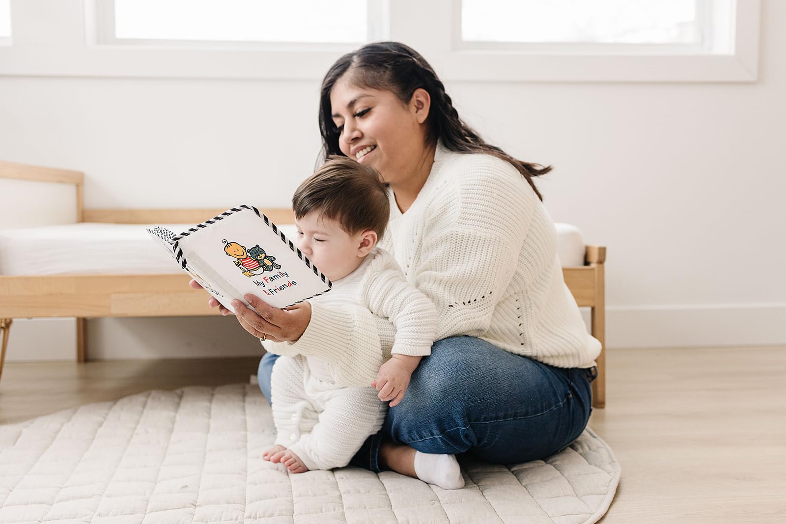 Genius Baby Toys family photo book for babies with durable fabric cover.