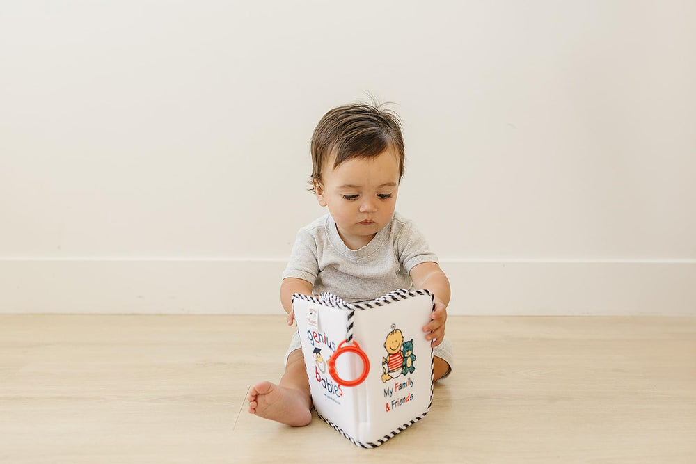 Genius Baby Toys photo book holds 17 photos with envelope pockets for memories.