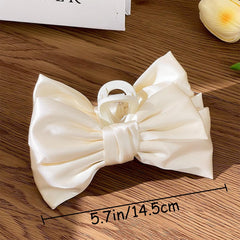 GeoGeoDIY satin bow clip closeup shows smooth fabric and durability.