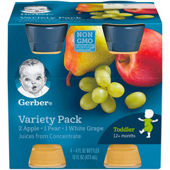 Gerber Juice Fruit bottle pour of apple juice into a cup for kids.
