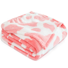 GEULAY light pink cow blanket in nursery crib scene for cozy comfort