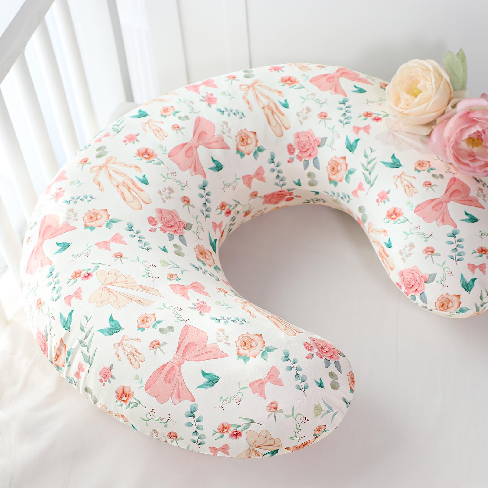 GFU nursing pillow cover showcases colorful bow and flower details for cheerful nursery decor