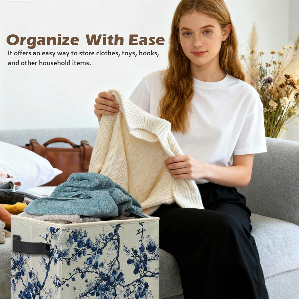 Ghoaoivo chinoiserie blue floral storage bin in the laundry area for quick clothing storage.