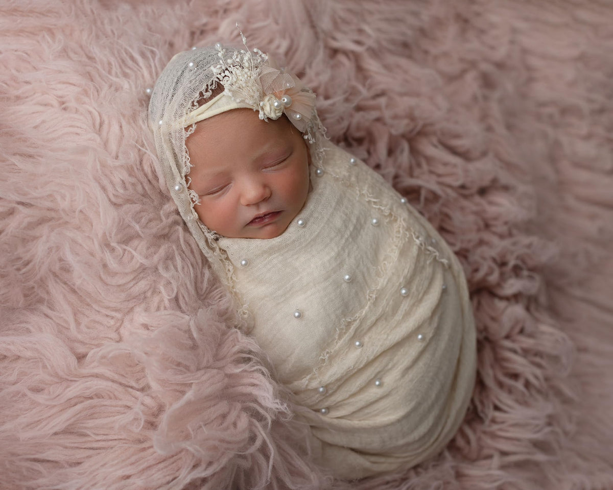 Giggle Angel newborn wrap pink soft fabric ready for gentle swaddling during photos