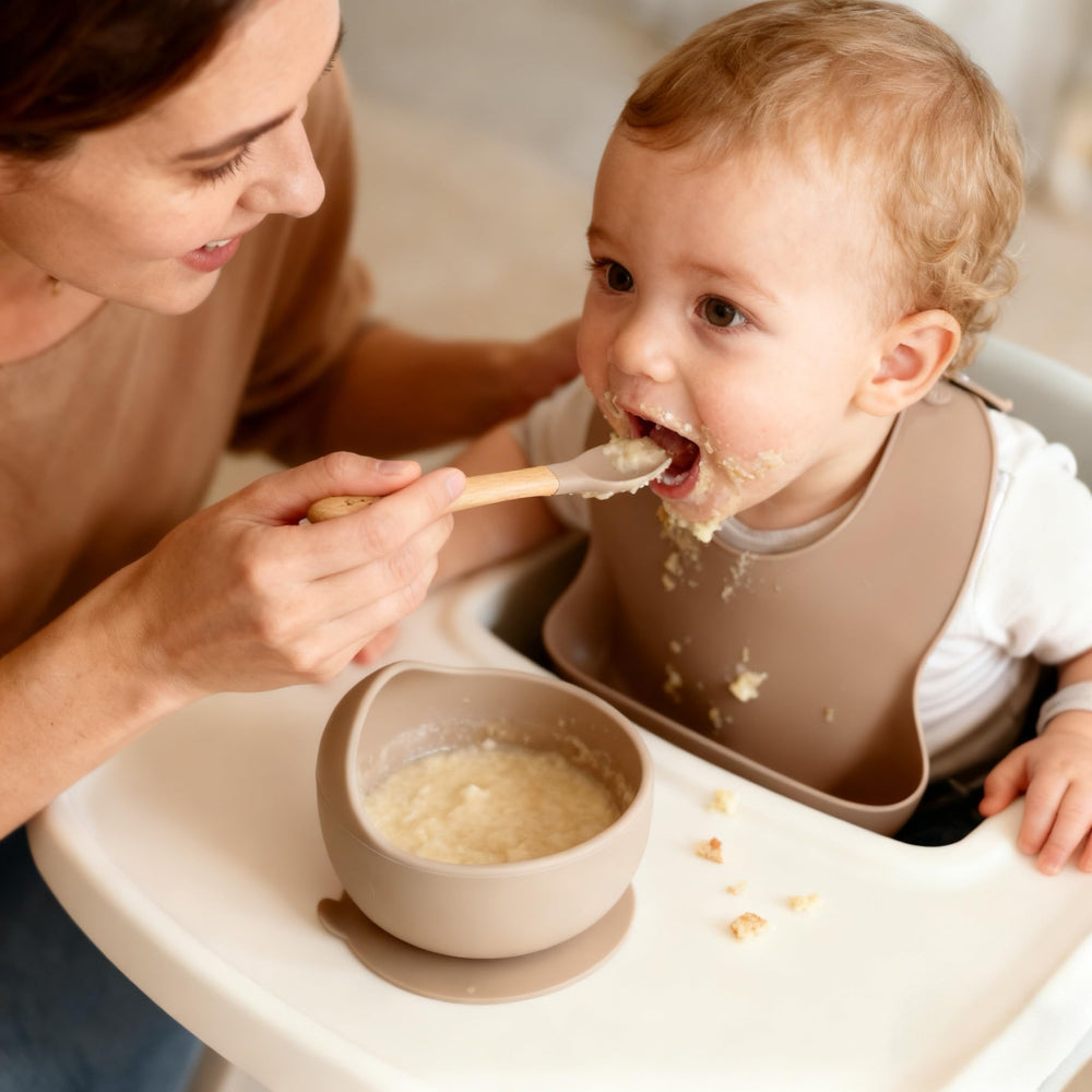 Ginbear spoon with organic beech handle for gum-friendly feeding.