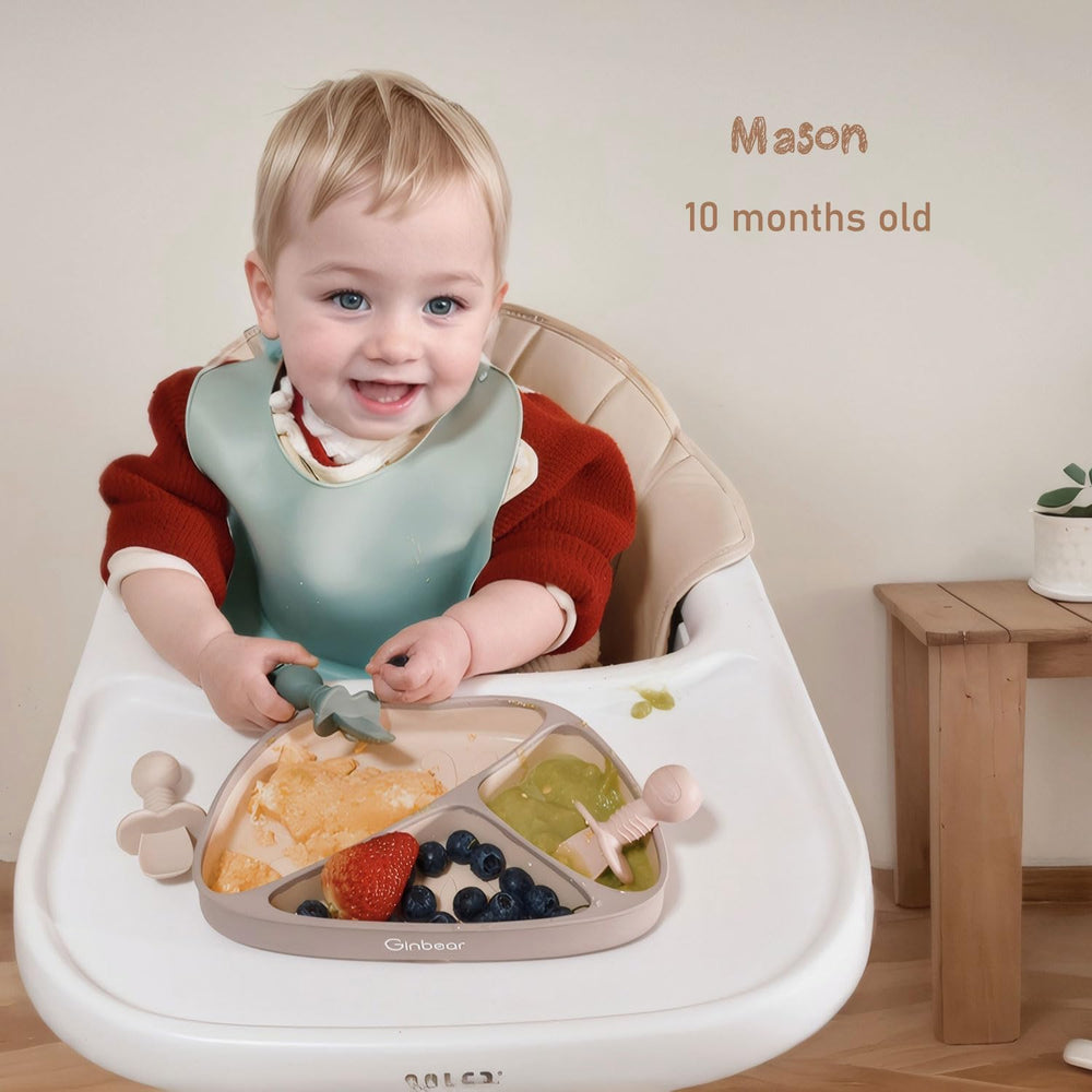 Ginbear Platinum Silicone Baby Spoons in-use scene demonstrates self-feeding practice.