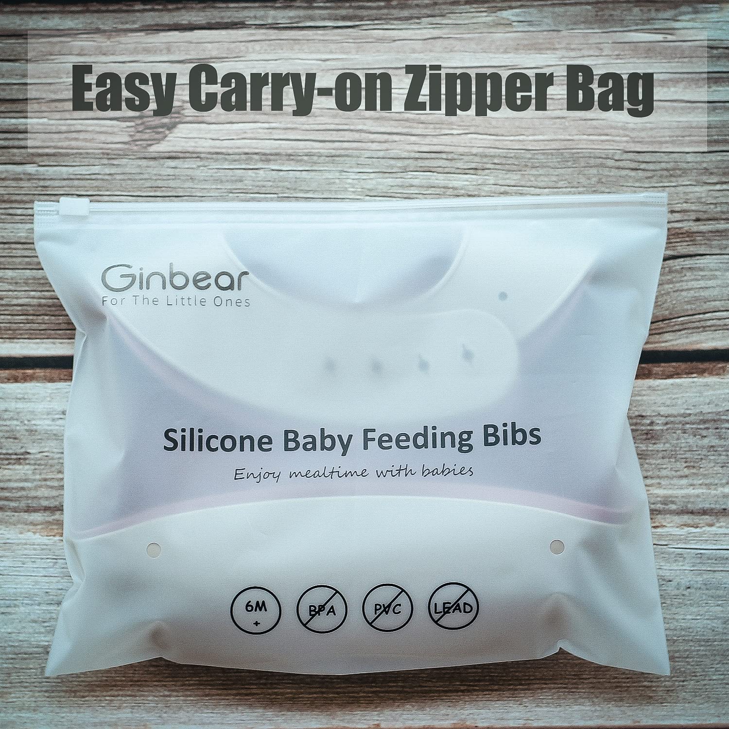 Ginbear silicone bib demonstrates a food-spill catch in action.