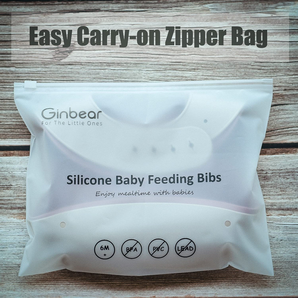 Ginbear silicone bib demonstrates a food-spill catch in action.