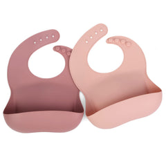 Ginbear silicone bib mauve-pink front view with waterproof fabric and pocket for mess-free meals.