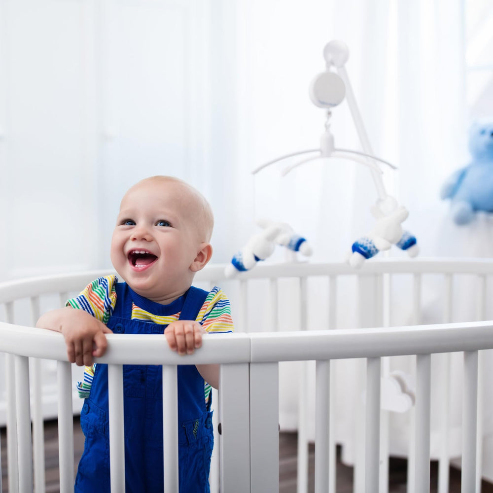 GlikCeil white mobile arm fits most cribs for versatile nursery decor