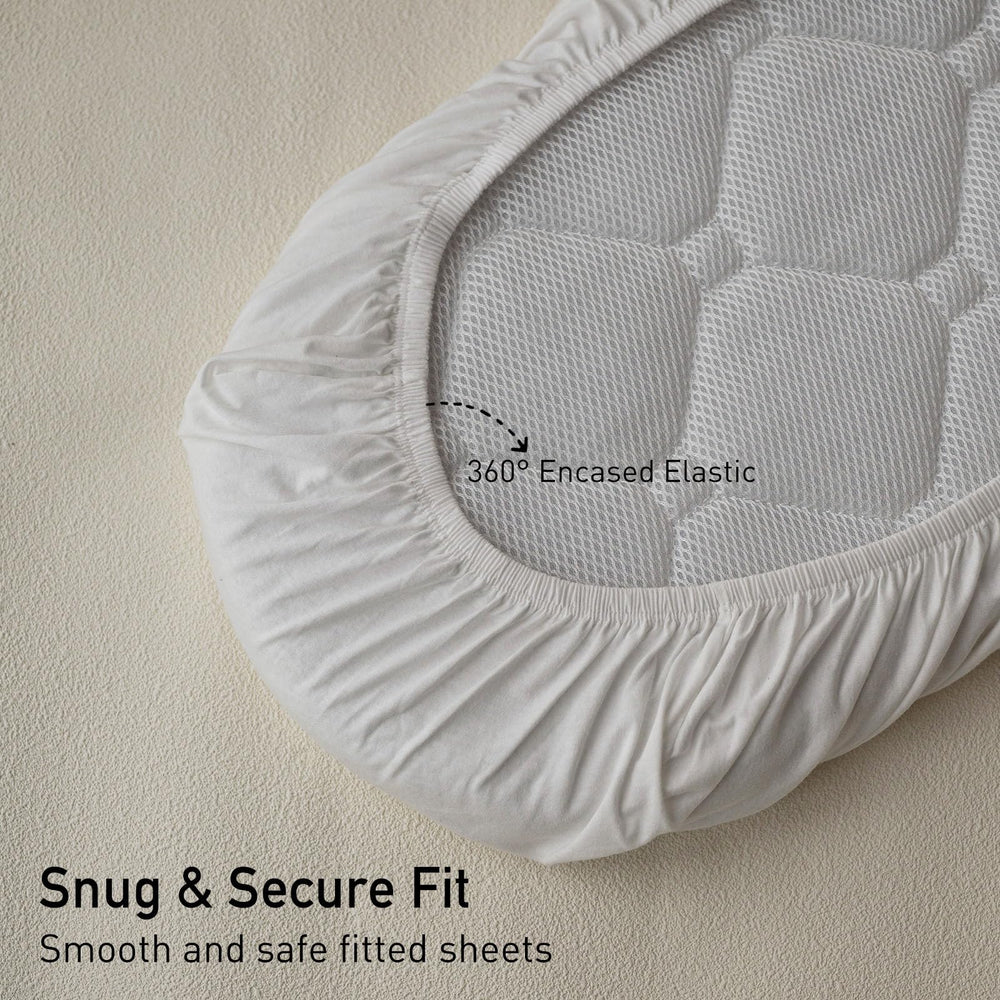 GLLQUEN BABY bassinet sheets on mattress demo showing secure fit.