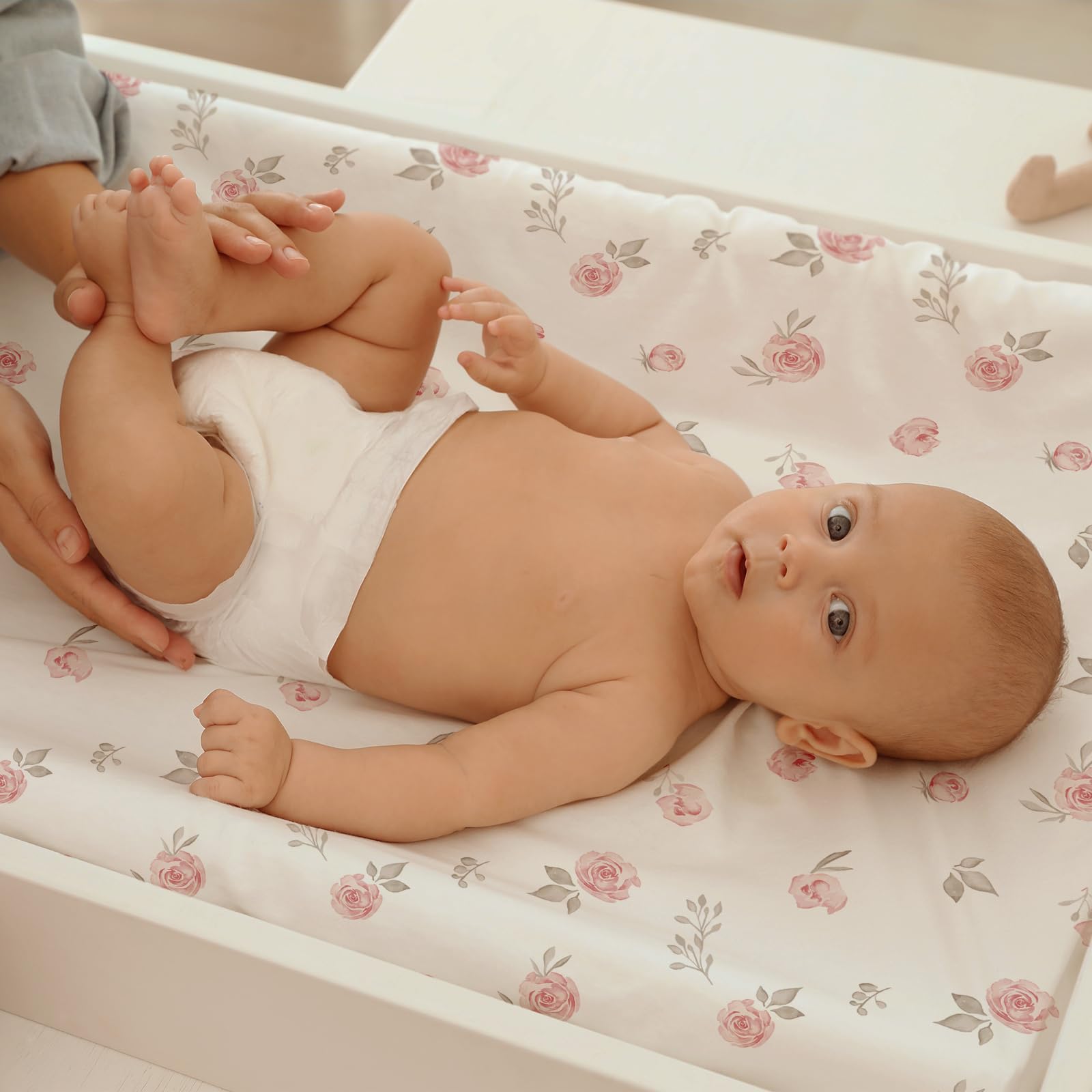 GLLQUEN BABY pink bassinet sheet in use for baby.