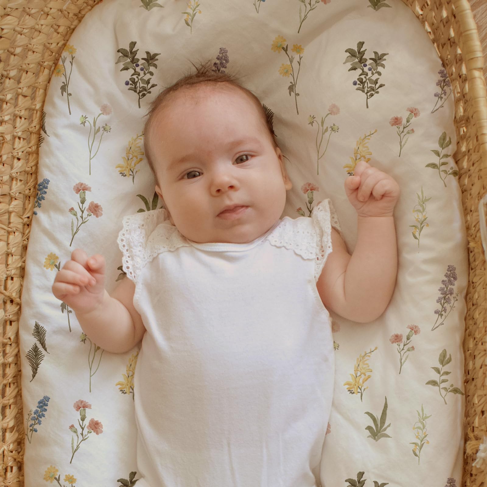 GLLQUEN BABY bassinet sheets ultra-soft fabric close-up on skin.