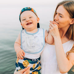 GLLQUEN BABY bib with large front flap provides chest coverage