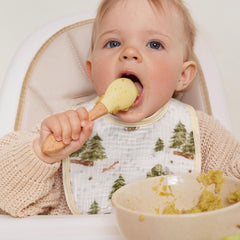 GLLQUEN BABY bib with adjustable snaps showing two size options for growing baby.