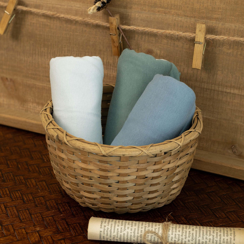GLLQUEN BABY nursery swaddle blankets in tranquil blue ideal for nursery decor.