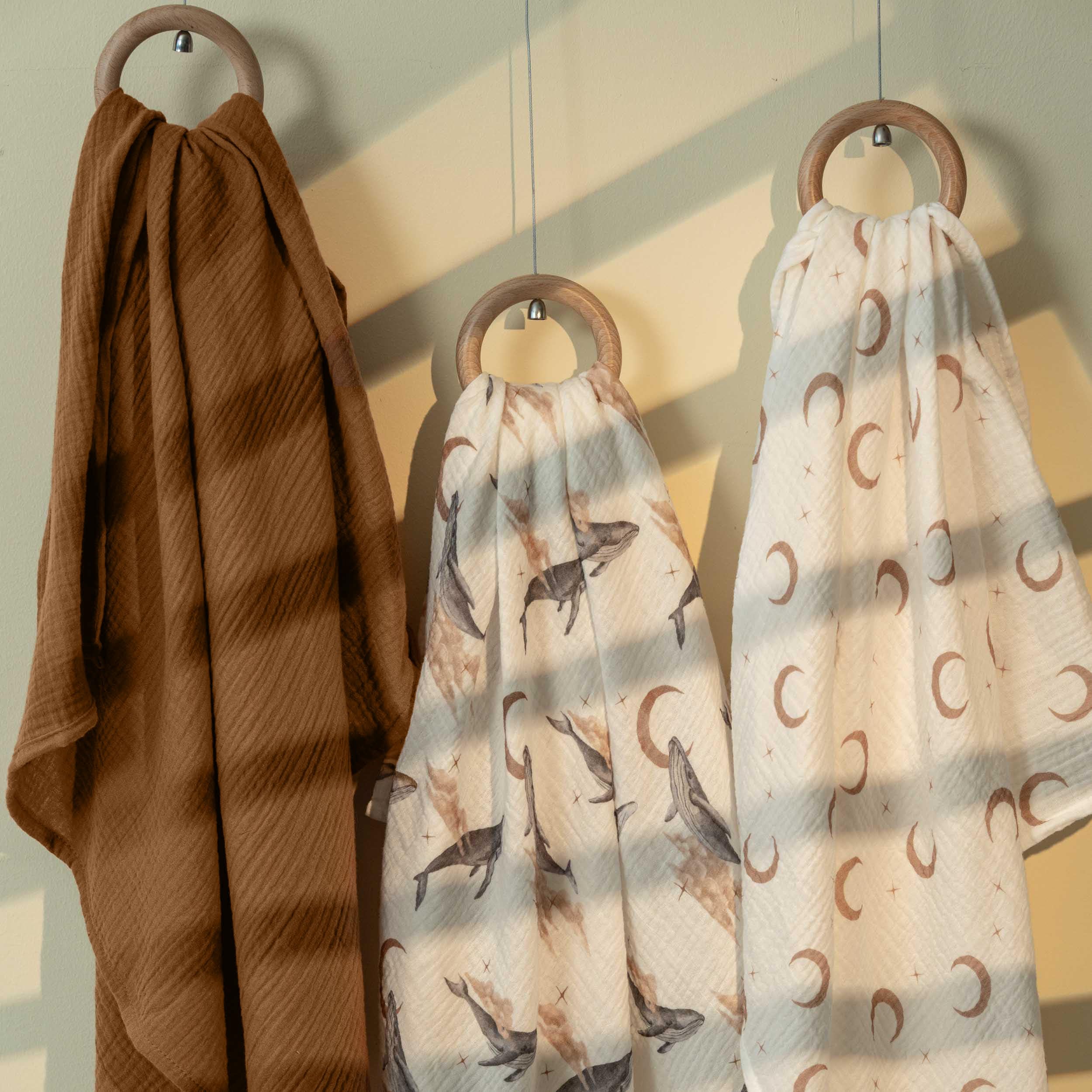 GLLQUEN BABY muslin blanket presented as a thoughtful registry gift.