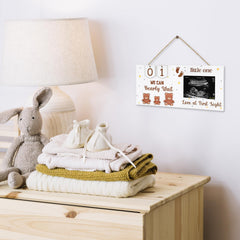 Glodecart wooden ultrasound frame on display shelf, a warm baby shower centerpiece.