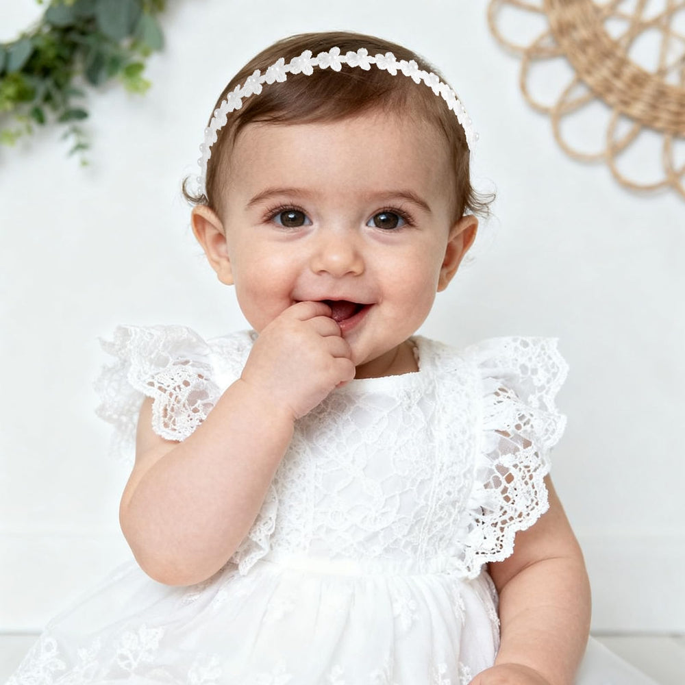Goktvai headband features flowers and pearls for timeless accessory detail.