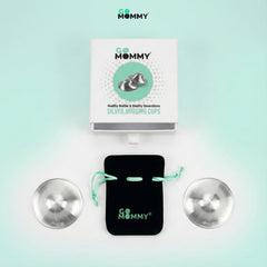 GoMommy silver nipple cups on hand illustrating compact, portable relief