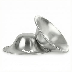 GoMommy silver nipple shields close-up showing smooth edges for comfortable, soothing relief.
