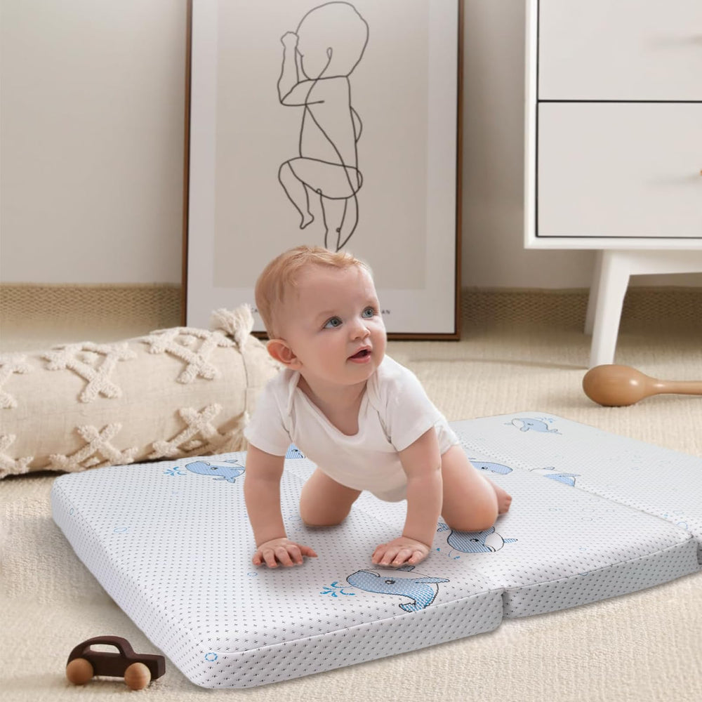 GOODFINDS trifold pack-n-play mattress folded for travel showing portable comfort.