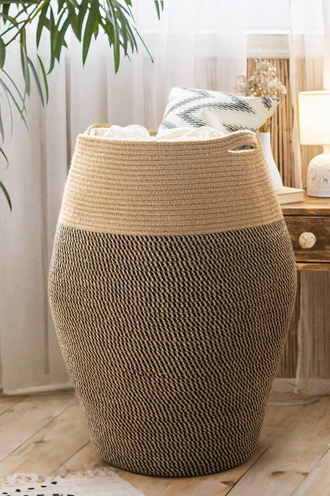Goodpick 105L jute rope laundry hamper full view in a modern bedroom for organized laundry storage.