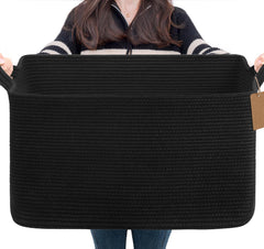 Goodpick woven storage basket in black for living room blanket organization and easy access.