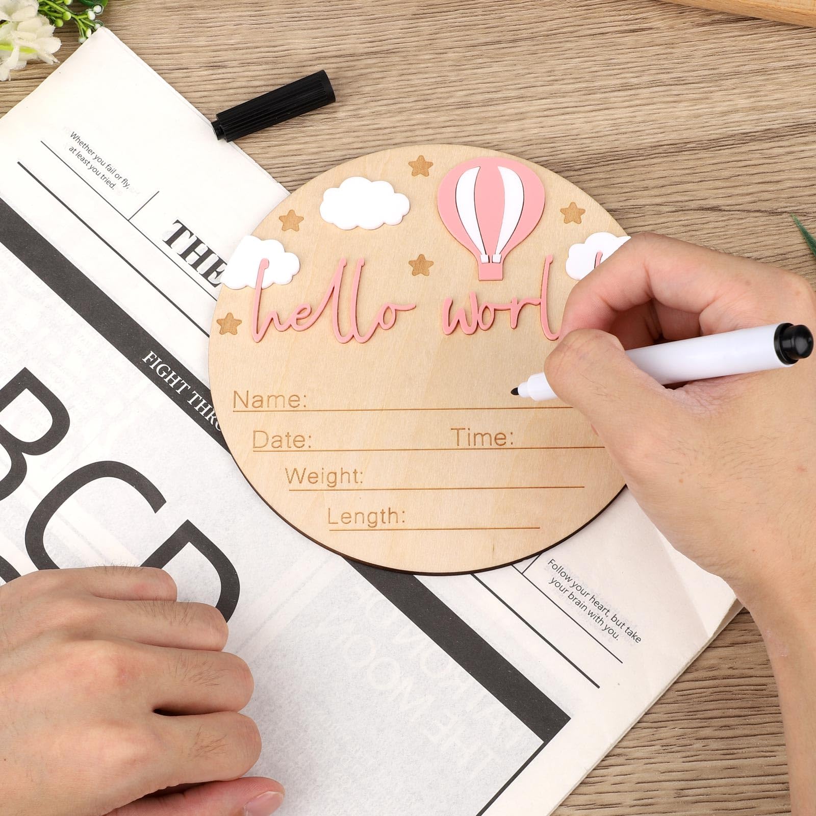 Gosknor wooden-baby-announcement-sign-photo-prop elevates first photos with a warm Hello World message.