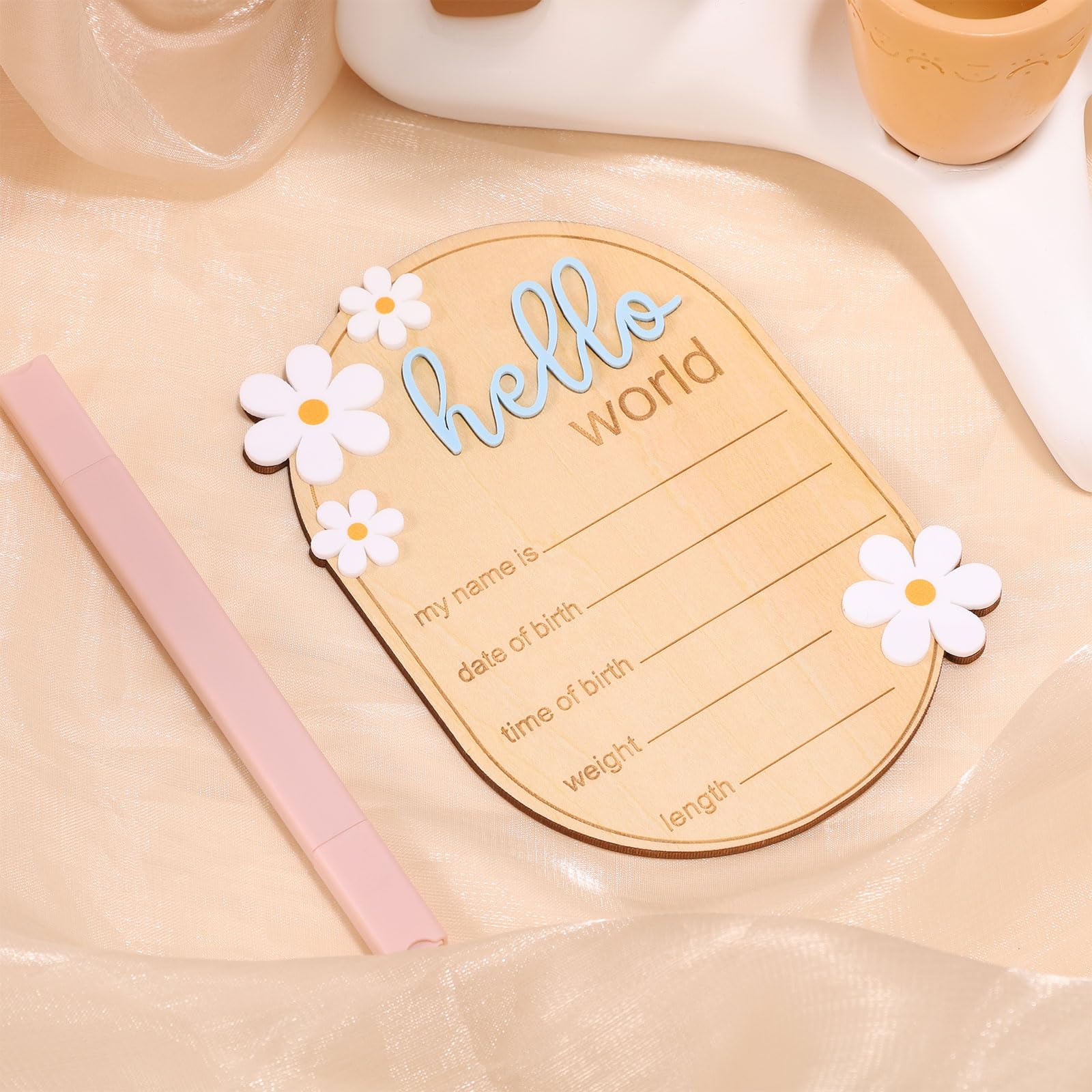 Gosknor wooden baby sign with daisy flowers enhances gentle nursery decor.