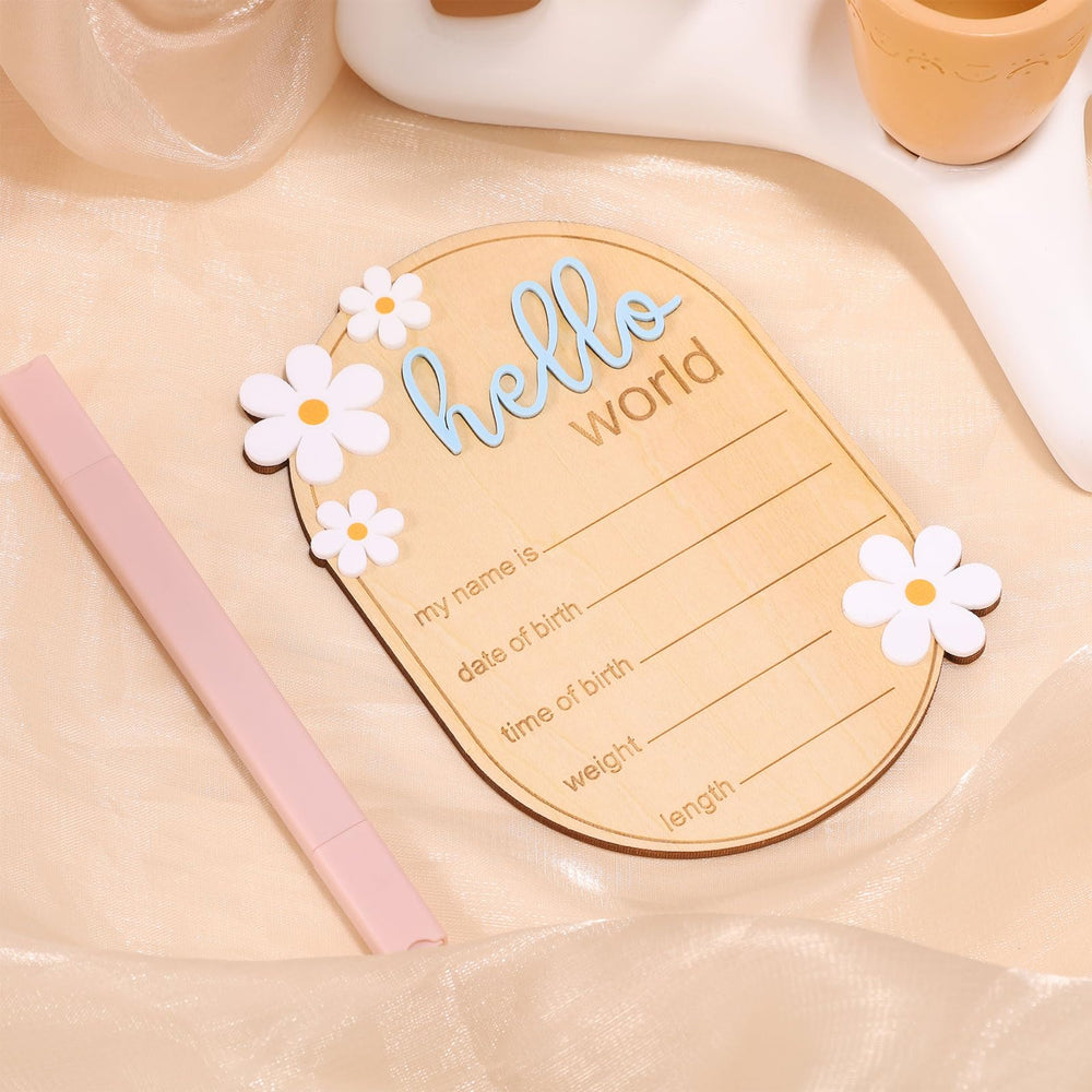 Gosknor wooden baby sign with daisy flowers enhances gentle nursery decor.
