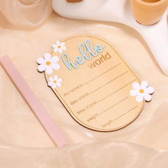 Gosknor wooden baby sign with daisy flowers enhances gentle nursery decor.