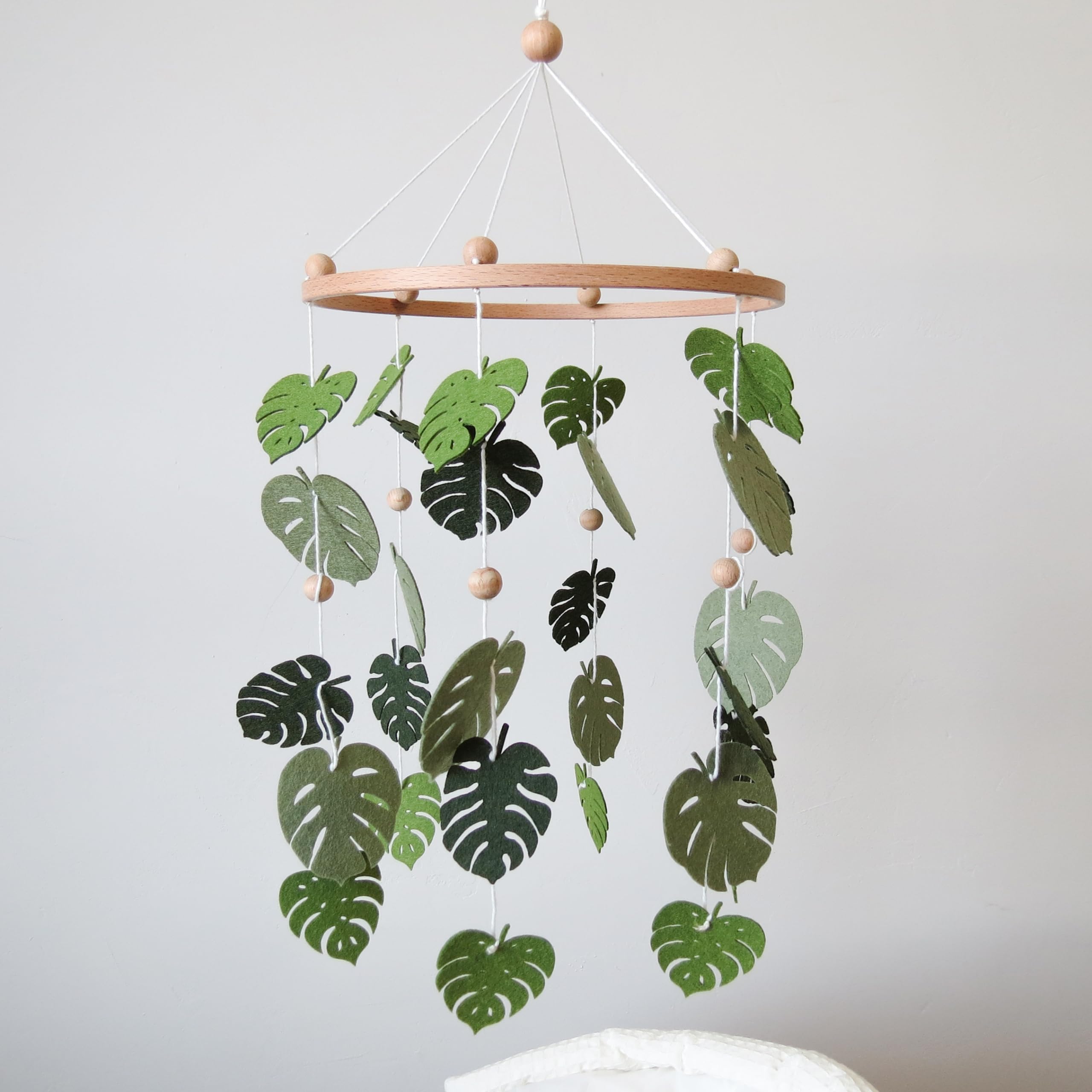Goukurlsma forest mobile creates soothing nighttime nursery ambience for baby sleep.