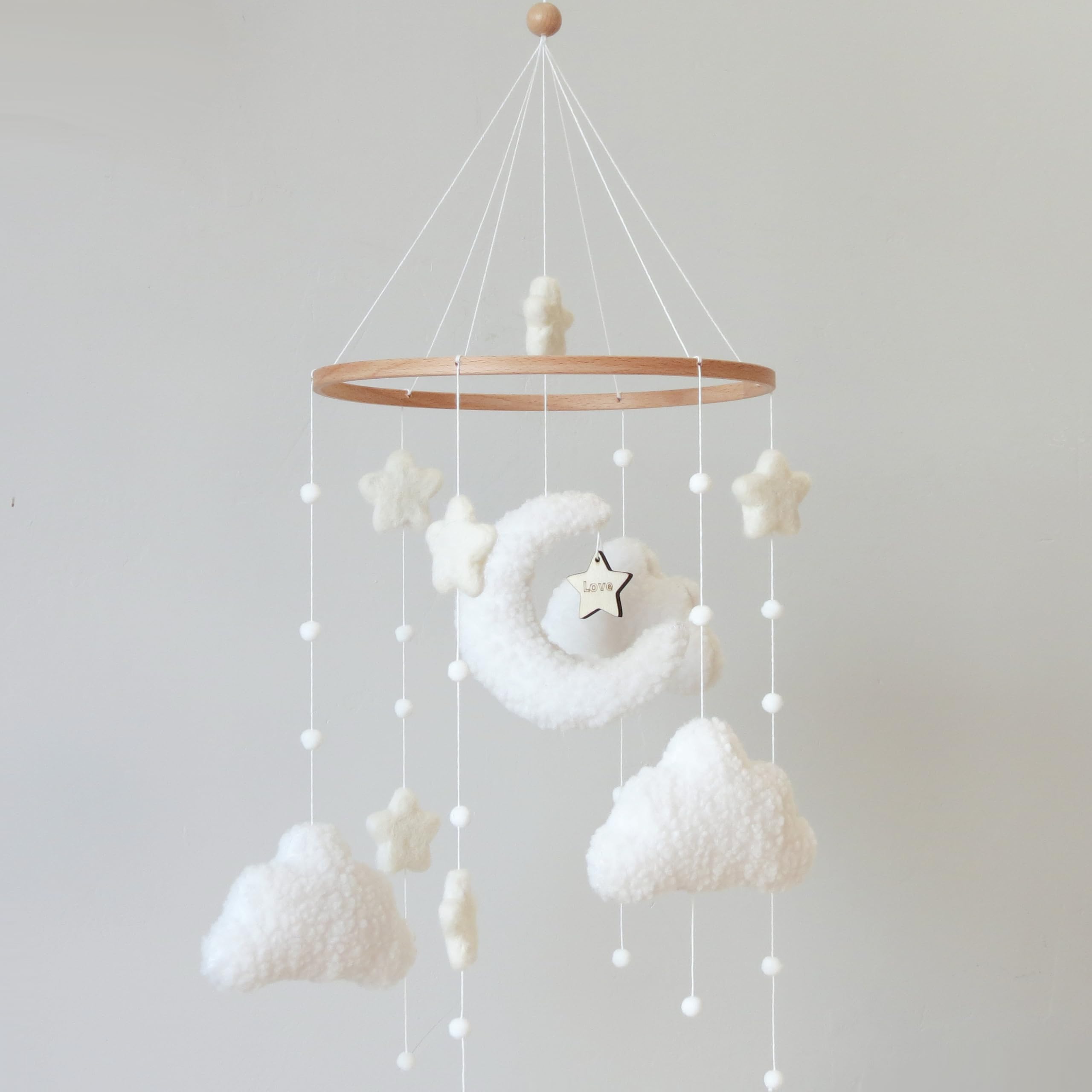 Goukurlsma boho crib mobile with cloud motif for visual focus and calming nursery decor.