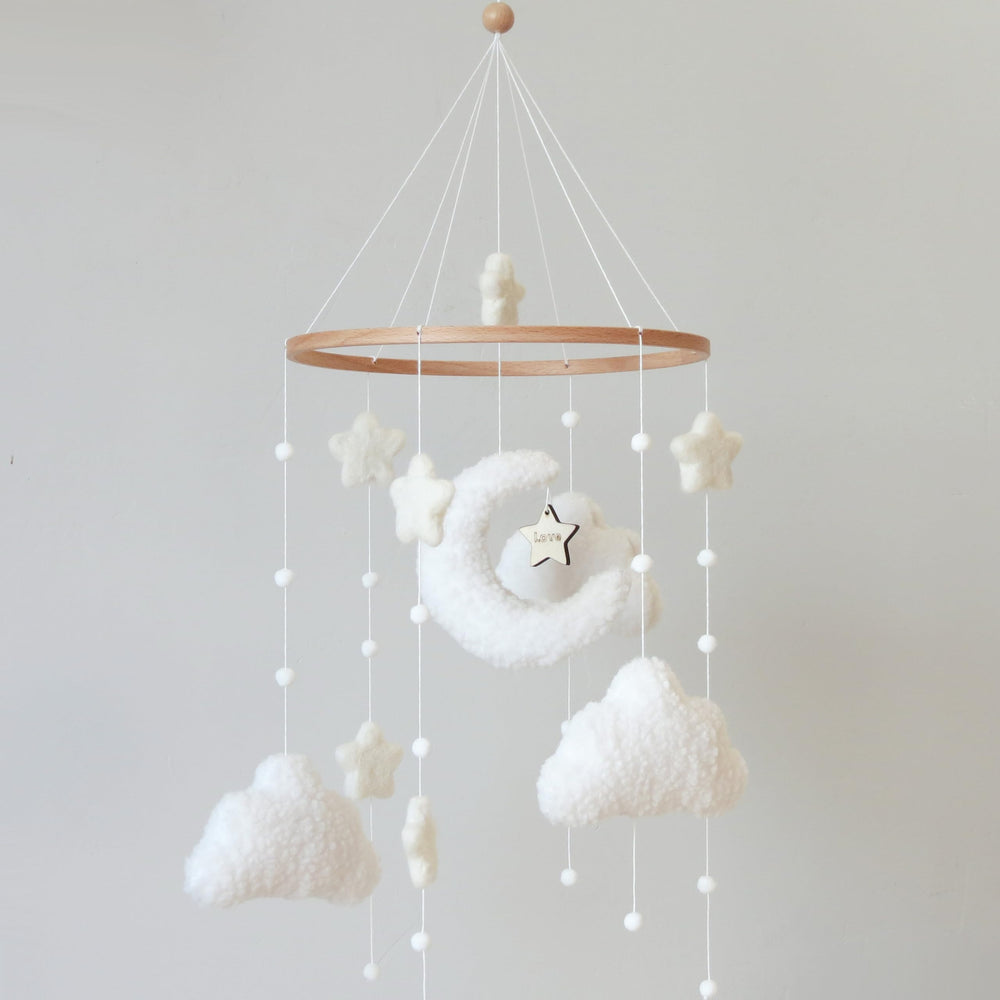 Goukurlsma boho crib mobile with cloud motif for visual focus and calming nursery decor.