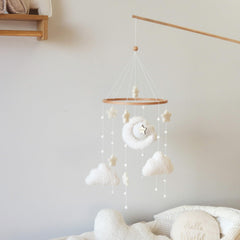 Goukurlsma boucle cloud fabric accent on mobile adds tactile texture for baby.