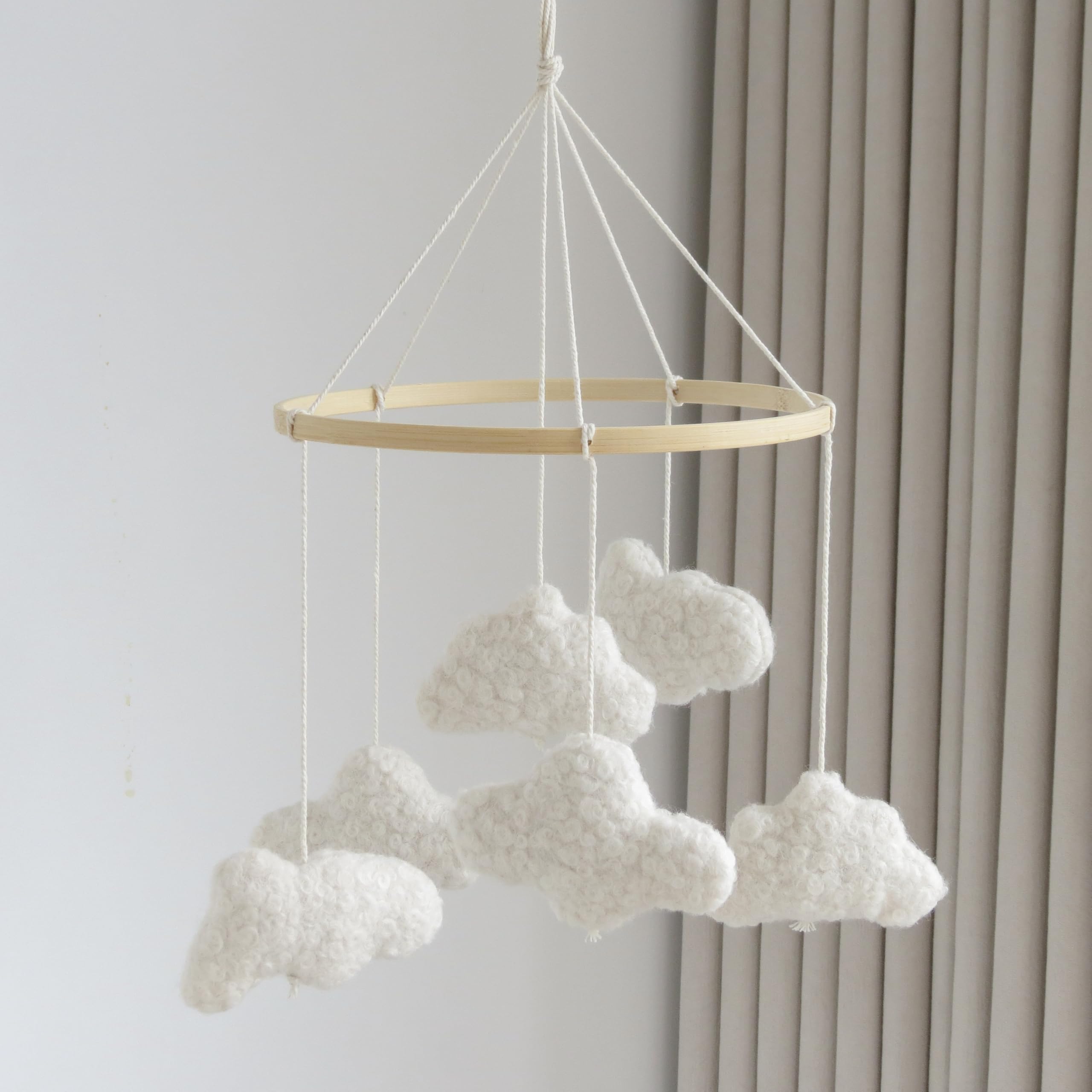 Goukurlsma Cloud Mobile for Crib with cream and wood accents enhances neutral nursery decor.