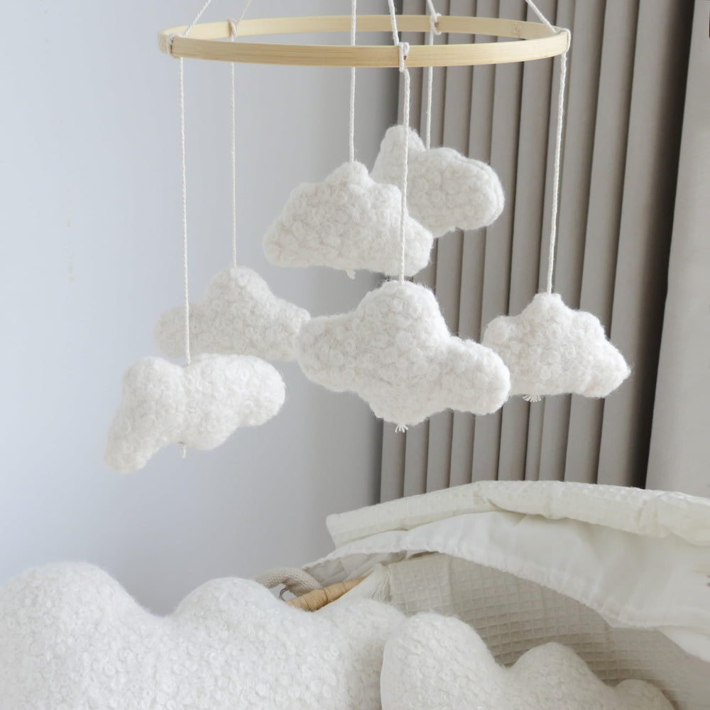 Goukurlsma Cloud Mobile hangs above crib creating a gentle sleep space.