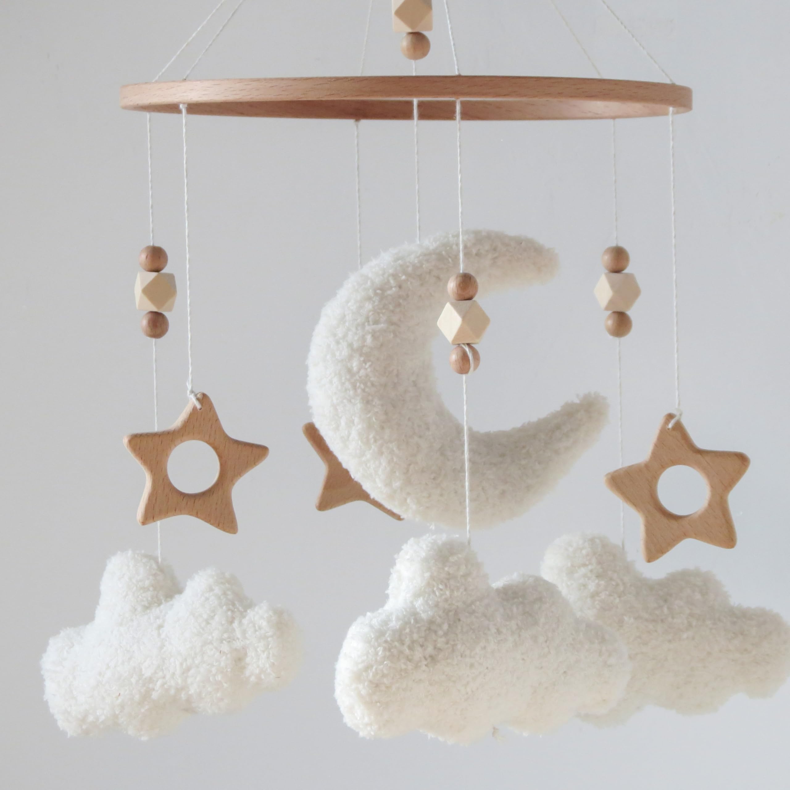 GOUKURLSMA cloud moon mobile in a nursery adds decorative charm and gentle visual stimulation