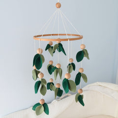 Goukurlsma Green Leaf Crib Mobile forest design enhances nursery decor and visual interest.
