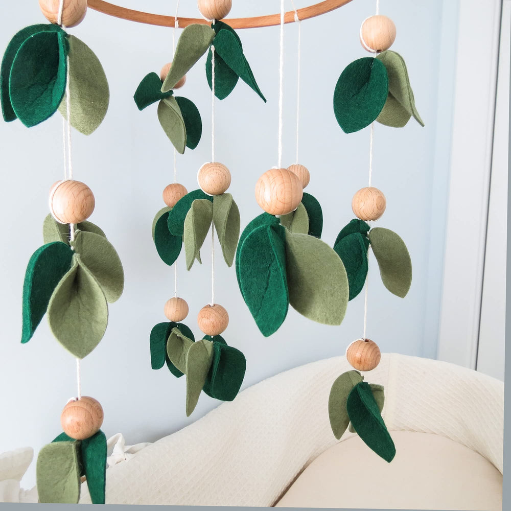 Goukurlsma Green Leaf Crib Mobile handmade craftsmanship adds natural charm.