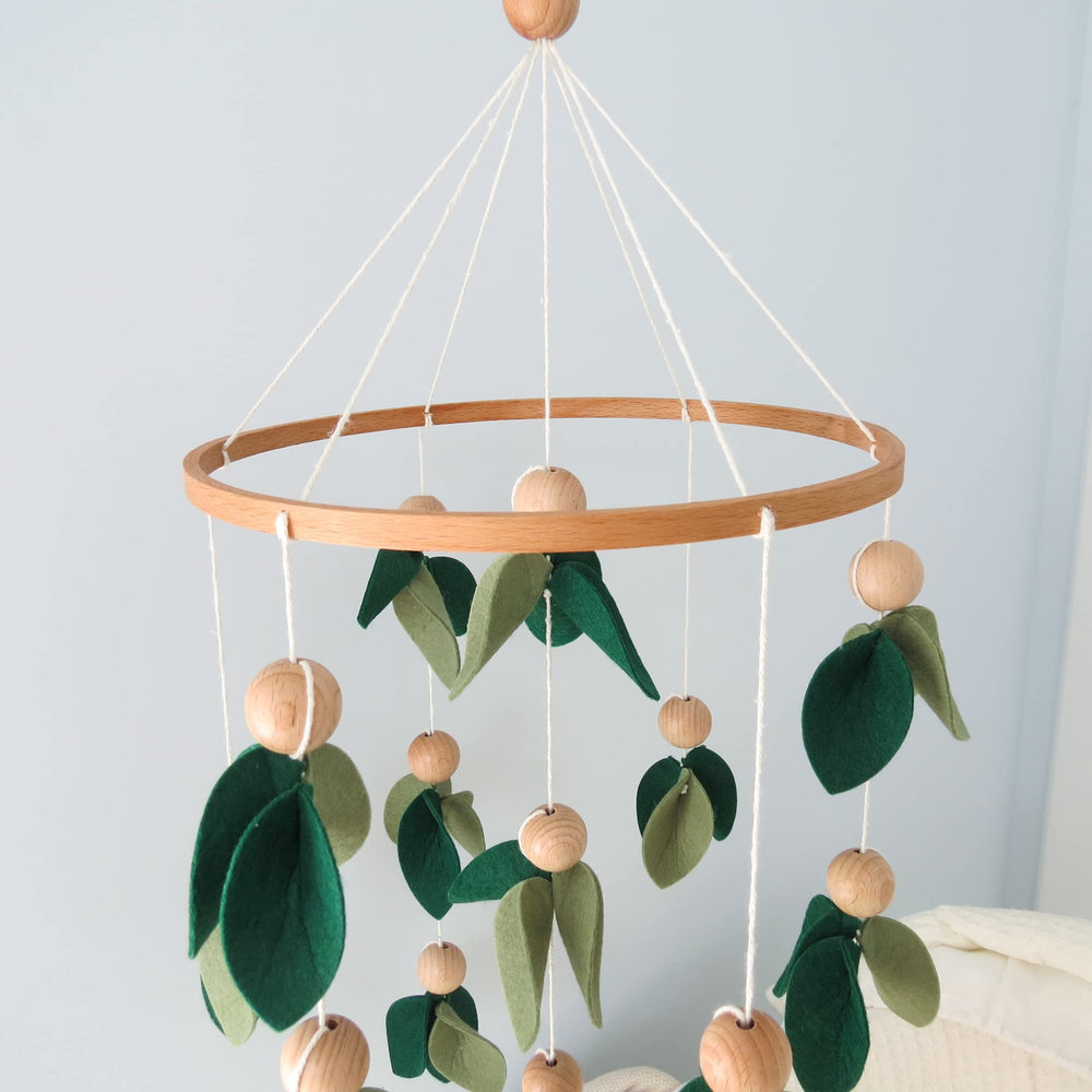 Goukurlsma Green Leaf Crib Mobile forest decor suitable for baby nursery.