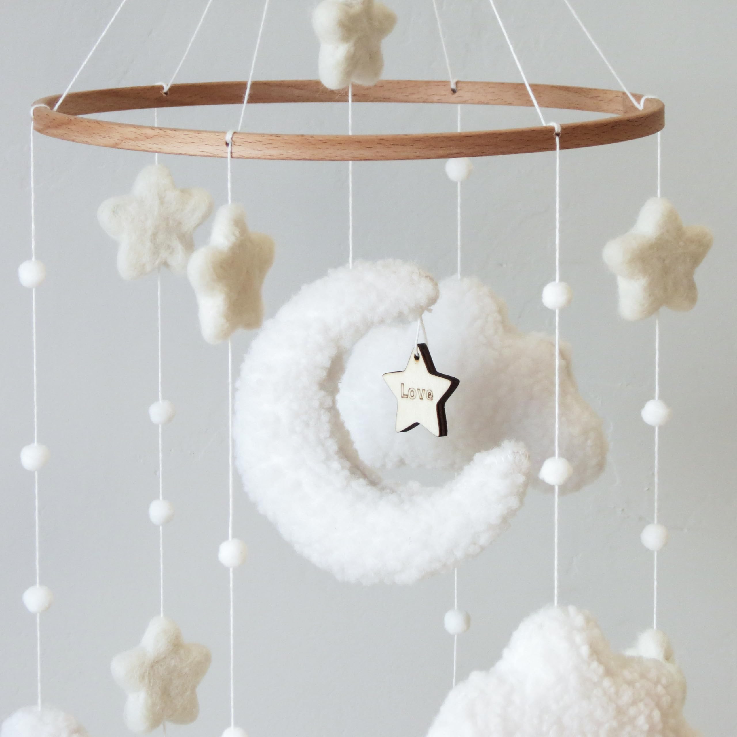 Goukurlsma ceiling-hanging mobile shown mounted for crib or arm use.
