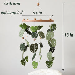 Goukurlsma monstera plant crib mobile adds calming, nature-inspired nursery ambiance.