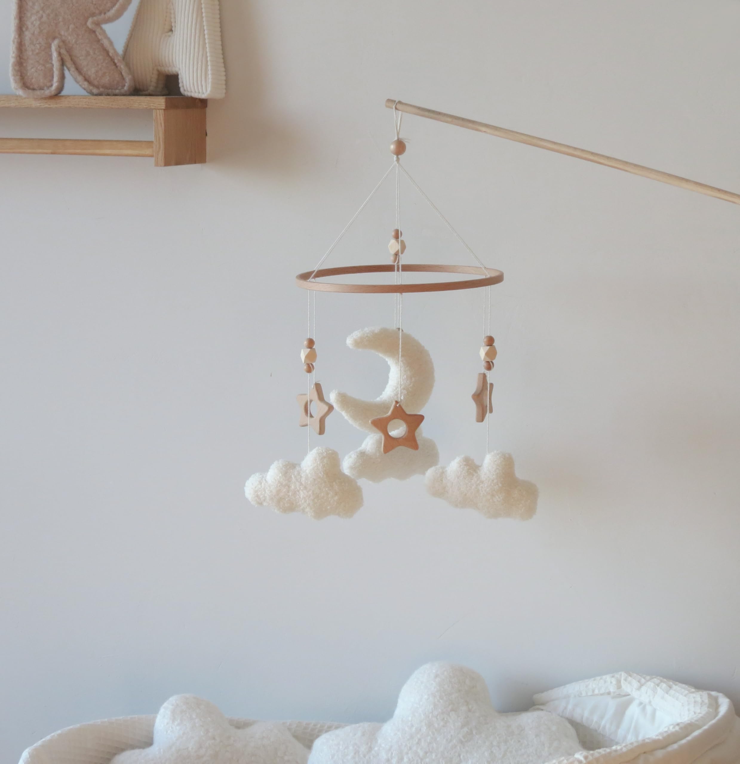GOUKURLSMA Wooden stars detail emphasizes natural decor for a calming nursery aesthetic