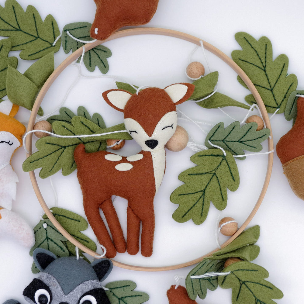 Goukurlsma woodland crib mobile fully displayed in a nursery setting