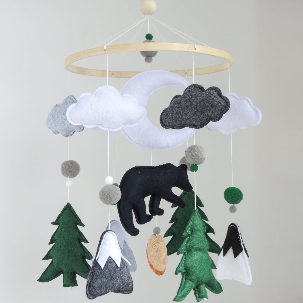 Goukurlsma woodland bear mobile center with moon promotes visual tracking for baby sleep.