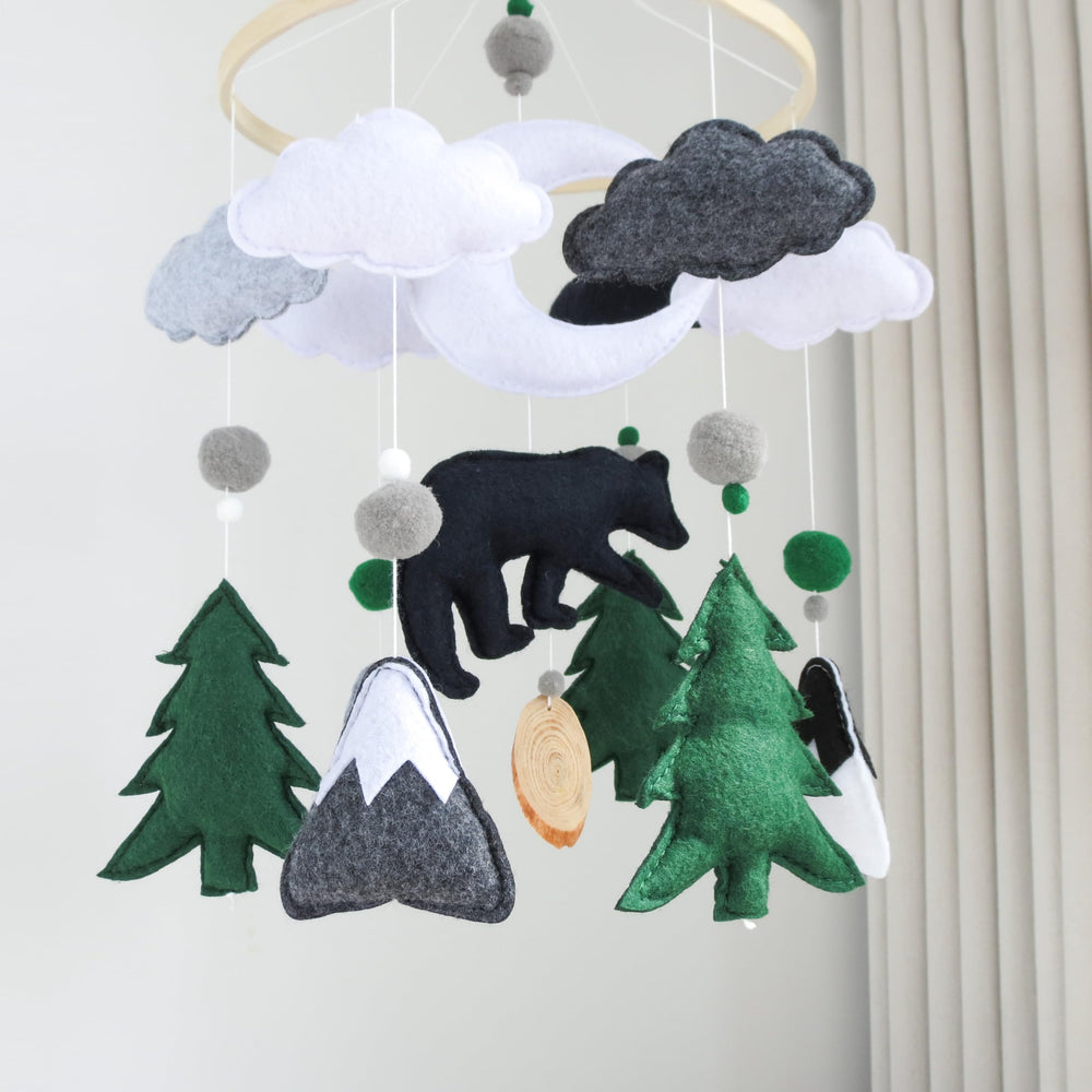 Goukurlsma woodland bear mobile with felt trees and mountains supports baby development.